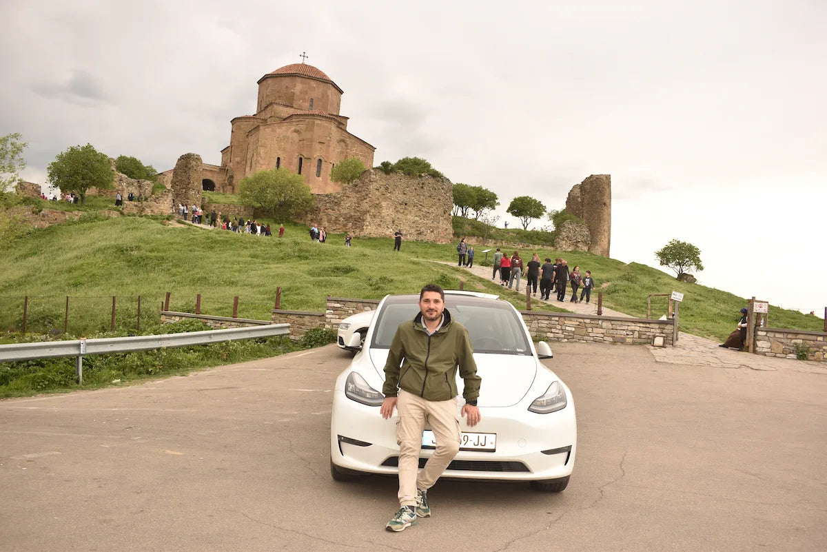 Georgi, your local private tour guide, at Jvari Monastery with the scenic Mtskheta landscape in the background
