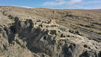 Aerial overview of the expansive ancient rock-hewn cave city of Uplistsikhe in Georgia