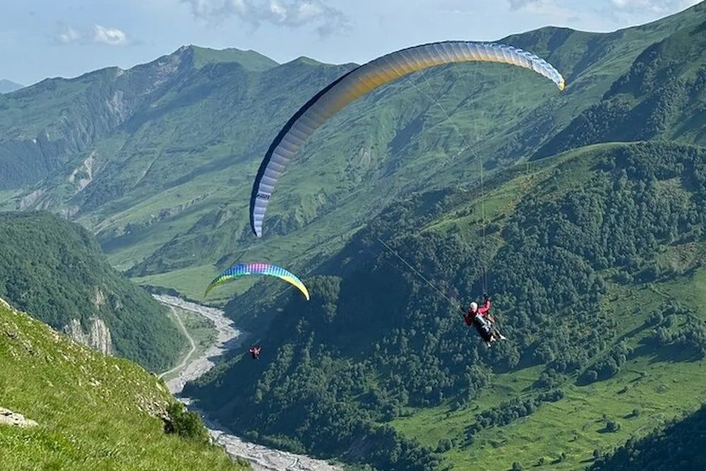 Tandem paragliding adventure over the scenic Gudauri mountains, Georgia