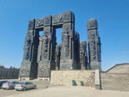 Close-up view of the towering architectural pillars at the Chronicles of Georgia monument.