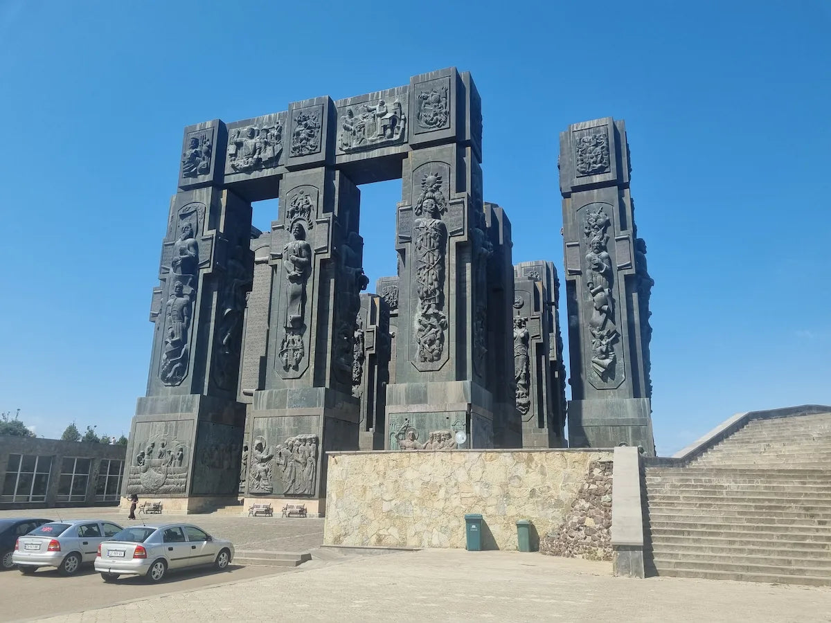 Close-up view of the towering architectural pillars at the Chronicles of Georgia monument.