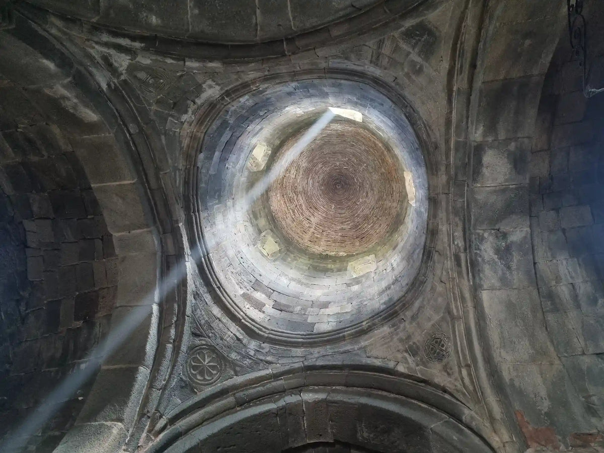 Historic stone dome interior architecture of Gergeti Trinity Church during a private cultural sightseeing tour in Kazbegi, Georgia