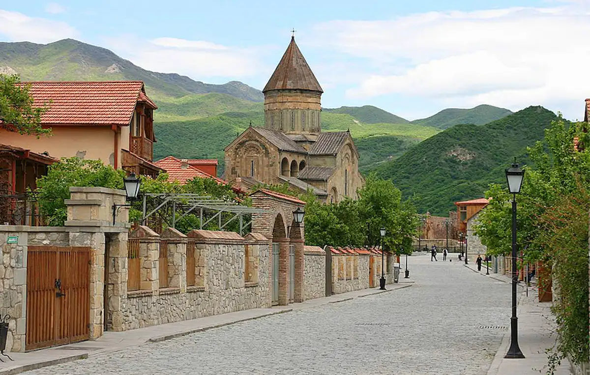 Panoramic view of Mtskheta, Georgia's ancient capital and UNESCO World Heritage site. Featuring Jvari Monastery and Svetitskhoveli Cathedral on a private one-day tour from Tbilisi