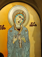 Detailed close-up of a vibrant Georgian Orthodox icon, featuring Saint Nino, discovered during a private tour of the Dzama Valley monasteries.