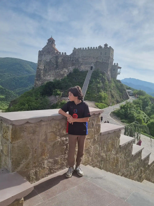 A breathtaking view of the Mzovreti fortress and monastery complex in the heart of the Dzama Valley, a highlight of our one-day private tour from Tbilisi.