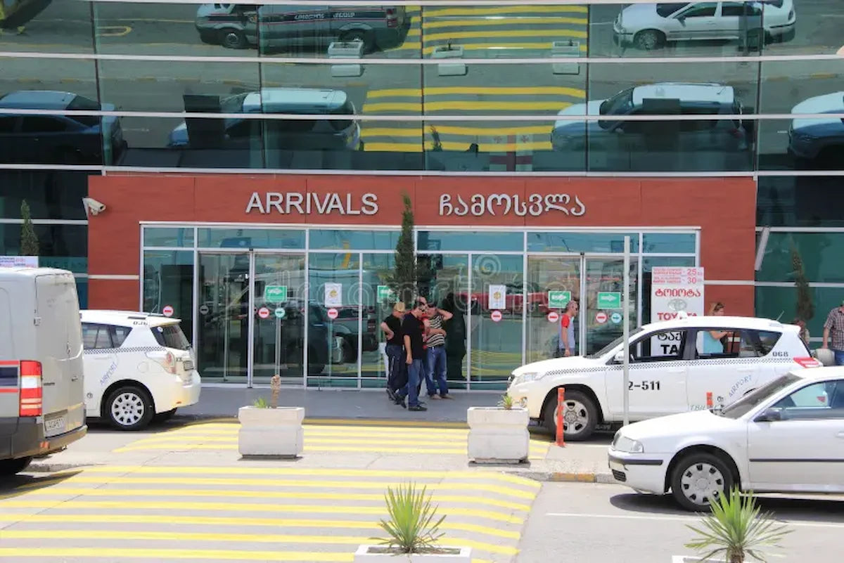 Tbilisi Airport Arrivals exit gate where Georgi Travels provides meet and greet services for international passengers.