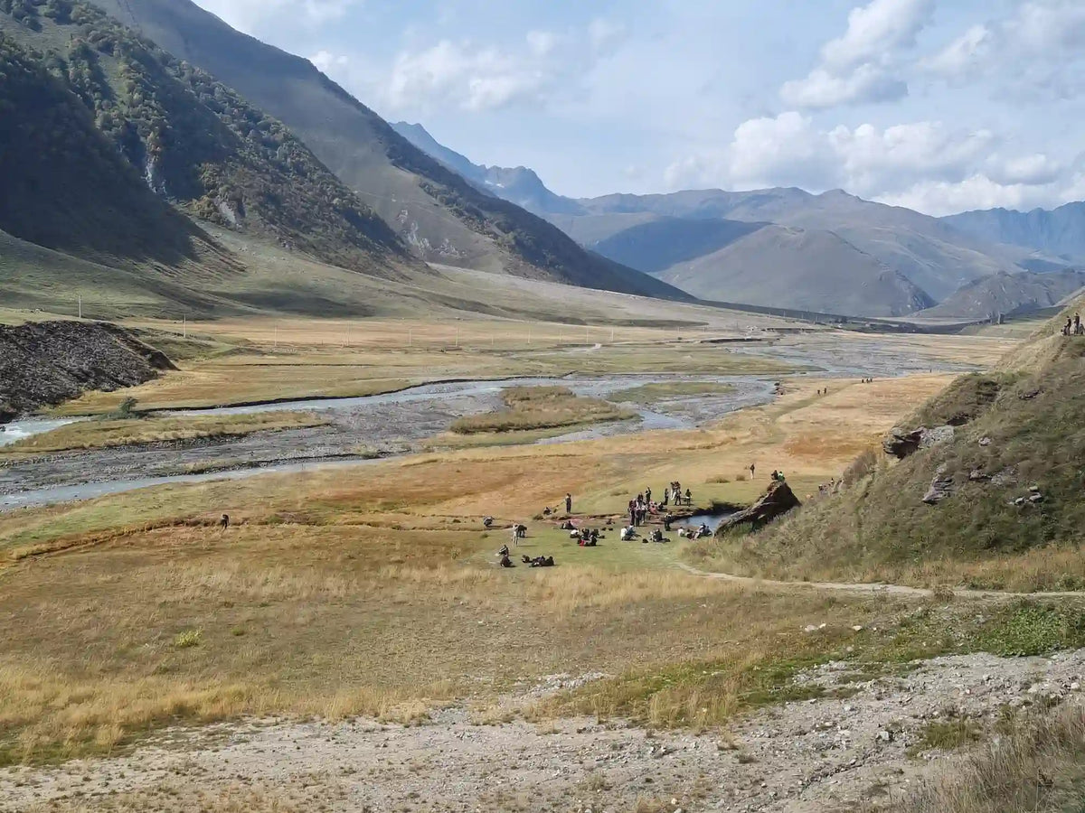 Truso Valley scenic river landscape and mountain hiking day trip destination in Kazbegi, Georgia.